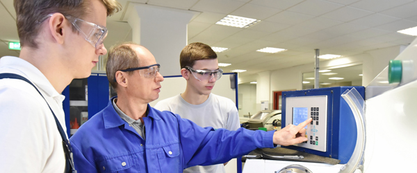 Image of team testing on machine