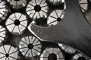 collection of collet chucks on table