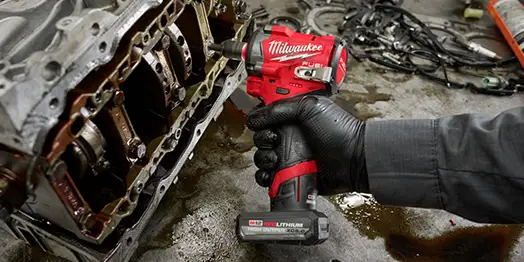 right hand using a Milwaukee impact wrench