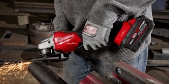 worker using a Milwaukee tool
