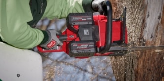 worker using a Milwaukee saw