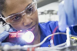worker inspecting a machine