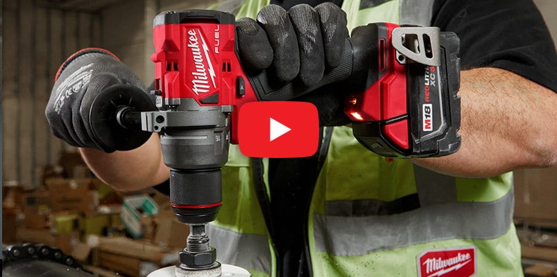 Milwaukee M18 Tool and Battery in use with video play button