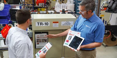 Two men discussing the lockout tagout plan