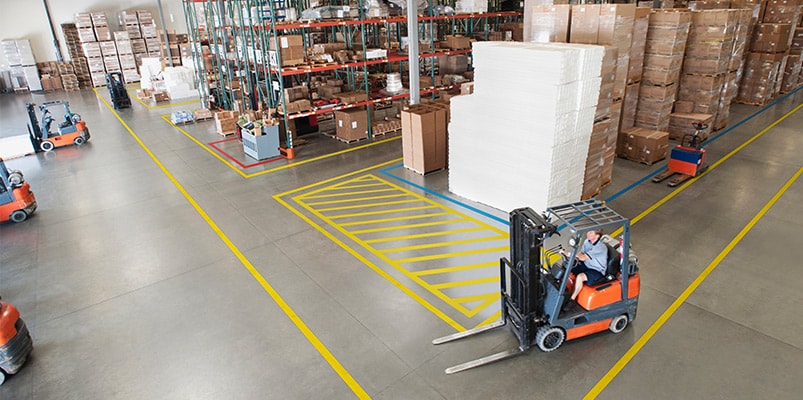 large warehouse with 3M marking tapes on floor