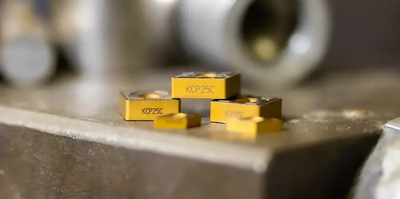 a stack of Kennametal KCP25C inserts