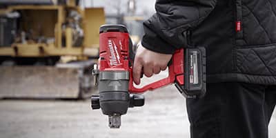 man holding impact wrench