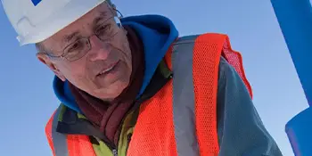 worker in safety hat and vest