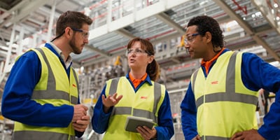 three workers in safety gear
