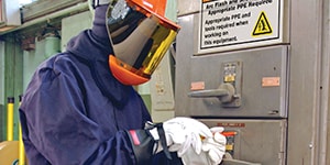 man taping electrical wires