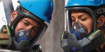 two people wearing personal protective equipment