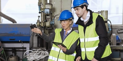image of two workers in safety gear