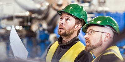 two men in safety gear