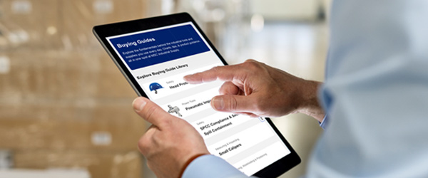 worker browsing Buying Guides on a tablet